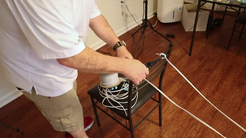 All I did was spread these two chairs 16 and 1/2 ft apart, and I’m going to run the cable in between them.